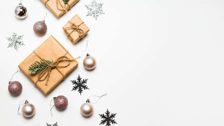 Christmas greeting card. Gift boxes and Christmas decorations layout on an isolated white background, top view. Flat layの写真素材