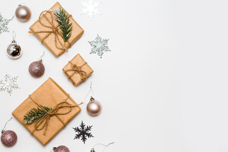 Christmas greeting card. Gift boxes and Christmas decorations layout on an isolated white background, top view. Flat layの写真素材