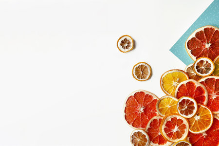 Flat lay composition of orange, lemon and grapefruit slices isolated on white background. Dried citrus slice with seeds. Concept dried citrusesの写真素材