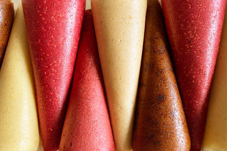 Fruit leather cones close up view. No sugar fruit leather cones. Healthy food. Apples strawberries, oranges close-up, top view.の写真素材