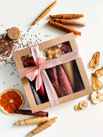 Fruit leather cones in cardboard box close up view. No sugar fruit leather cones. Healthy food.の写真素材