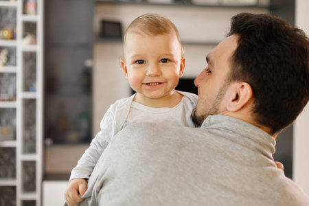 Infant baby and father. Son and dad