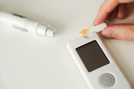 Close-up Of A Man's Hand Testing High Blood Sugar With Glucometer