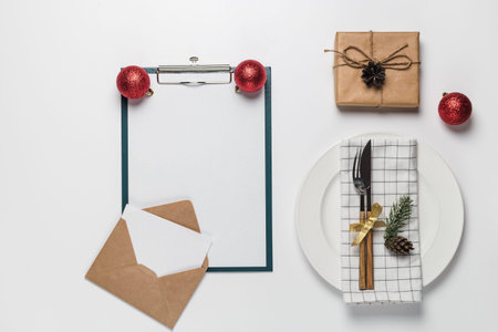 Christmas and new year blank menu and invitation in envelope on white with dish christmas...