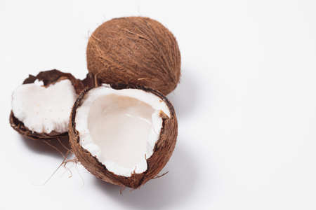 Coconuts with coconut half isolated on a white backgroundの写真素材