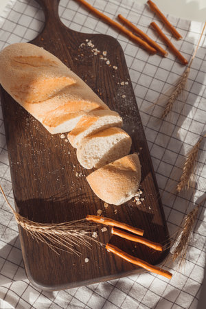 Ciabatta bread with ears of wheat.の写真素材