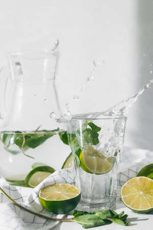 Detox water with lime fruit and mint leaves. Mint fresh homemade lemonade.の素材 [FY310185652702]