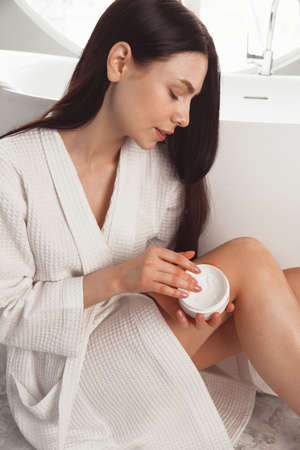 beautiful woman hands with creamの写真素材