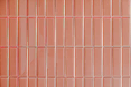 Pink glossy upright rectangular ceramic tile, background, texture.の写真素材