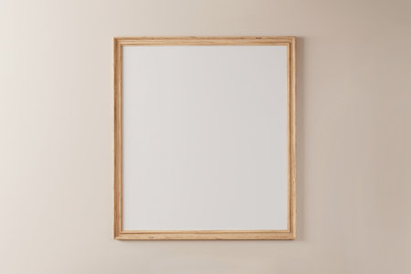 Wooden frame with white background on pastel painted wallの写真素材