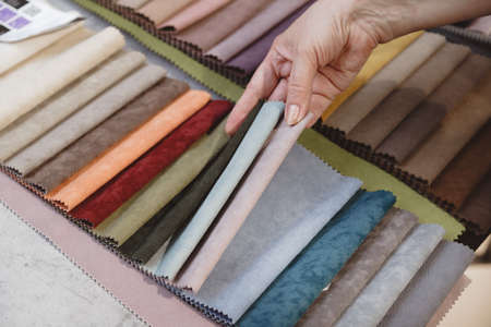 Hand pick the colorful upholstery samples in the shopの写真素材