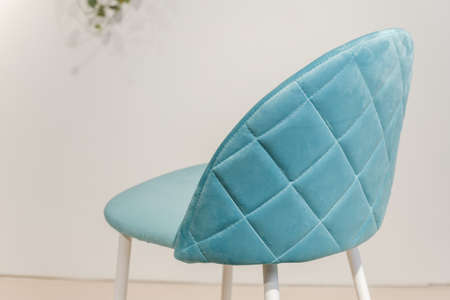 Modern velours armchair in a roomの写真素材