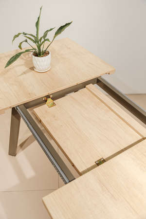 Extendable dinning table. Slide gear close up viewの写真素材
