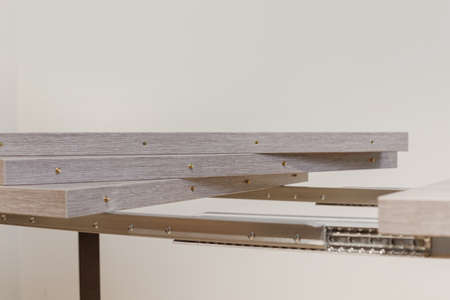 Extendable dinning table. Slide gear close up viewの写真素材