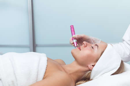 Woman having facial treatment in beauty salon, closeup. Oxy derma therapyの写真素材