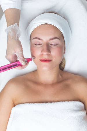 Woman having facial treatment in beauty salon, closeup. Oxy derma therapyの写真素材