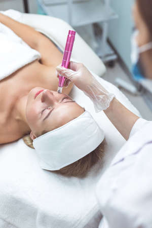 Woman having facial treatment in beauty salon, closeup. Oxy derma therapyの写真素材
