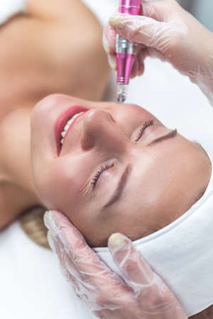 Woman having facial treatment in beauty salon, closeup. Oxy derma therapyの写真素材