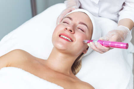 Woman having facial treatment in beauty salon, closeup. Oxy derma therapyの写真素材