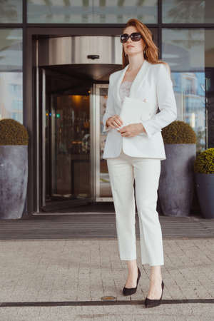 Super busy business woman wear fashion white suit and black heels, style office every dayの写真素材