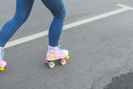 Close-up Of Legs Wearing Roller Skating Shoe, Outdoorsの写真素材