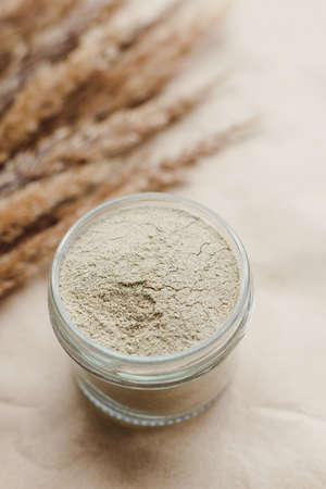 Ayurvedic cosmetic ubtan for face and hair care in glass jars. Vegetable ingredients ground into a powder.の写真素材