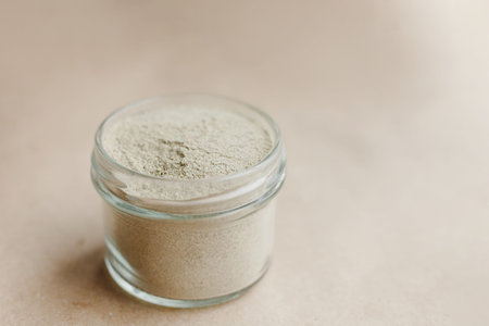 Ayurvedic cosmetic ubtan for face and hair care in glass jars. Vegetable ingredients ground into a...
