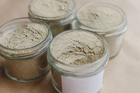 Ayurvedic cosmetic ubtan for face and hair care in glass jars. Vegetable ingredients ground into a powder.の写真素材