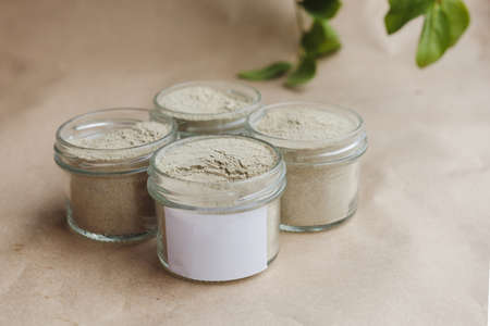 Ayurvedic cosmetic ubtan for face and hair care in glass jars. Vegetable ingredients ground into a powder.の写真素材