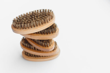 Brown wooden beard brush isolated on a white background - Packshot