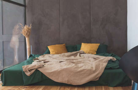 Modern bedroom in the attic of contemporary house.の写真素材