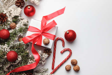 Christmas or New Year background, plain composition made of decorations and fir branches, flat lay, top view, blank space for textの写真素材