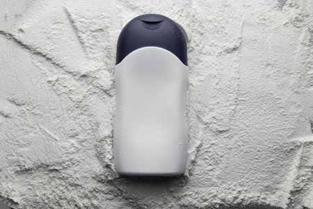 Plastic bottle on white baby cosmetic talcum powder background. Mock up, flat lay.の写真素材