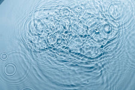 Blue water texture, blue pure water surface with waves and ripples. Flat lay, copy space.の写真素材