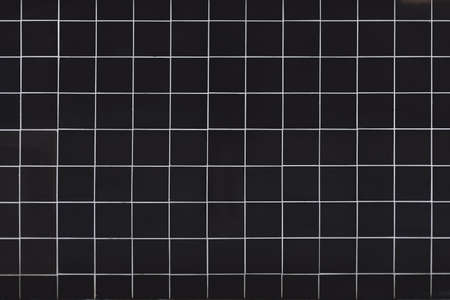 Black tile texture with white seams.の写真素材
