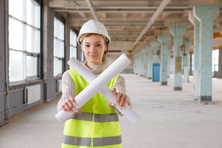 Woman architect in protective helmet on construction site gesture prohibitionの写真素材