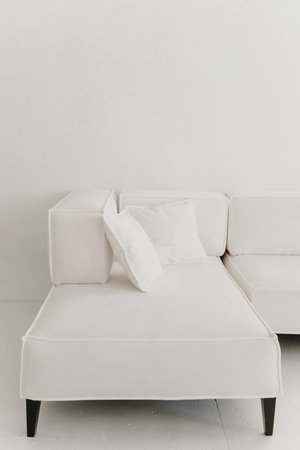 White large Sofa with pillows in white living room.の写真素材