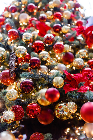 Close up of balls on christmas tree. Bokeh garlands in the background. new year concept