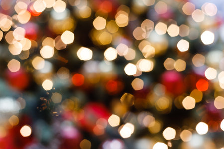 Close up of balls on christmas tree. Bokeh garlands in the background. new year conceptの写真素材