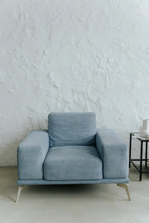 Living room interior with blue armchair and white wallの写真素材