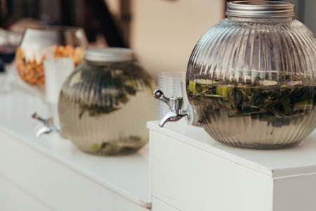 Coffee shop counter with fresh green tea in glass jar.の写真素材