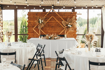 Wedding Banquet Hall, set tables with white tableclothsの写真素材