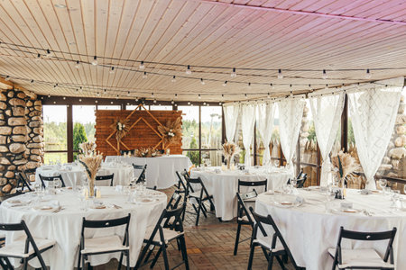 Wedding Banquet Hall, set tables with white tableclothsの写真素材