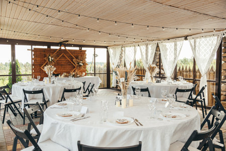 Wedding Banquet Hall, set tables with white tableclothsの写真素材