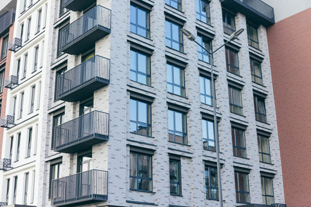 Contemporary apartment building with modern facade with balconies, residential construction