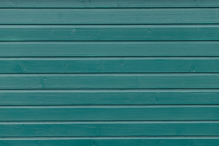 The turquoise surface, wooden lumber facadeの写真素材