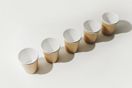 Many Recyclable Cardboard Disposable Cups on White.