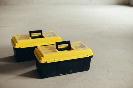 Two Closed Tool Cases With Handles And Latches Positioned Side By Side.