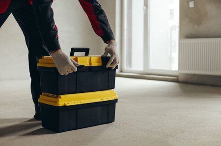 Worker Hands Opening Tool Case Lid With Latches And Clamps.