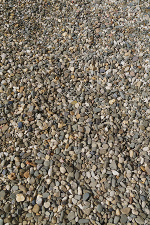 Background composed of thousands of small stones, vertical frameの写真素材